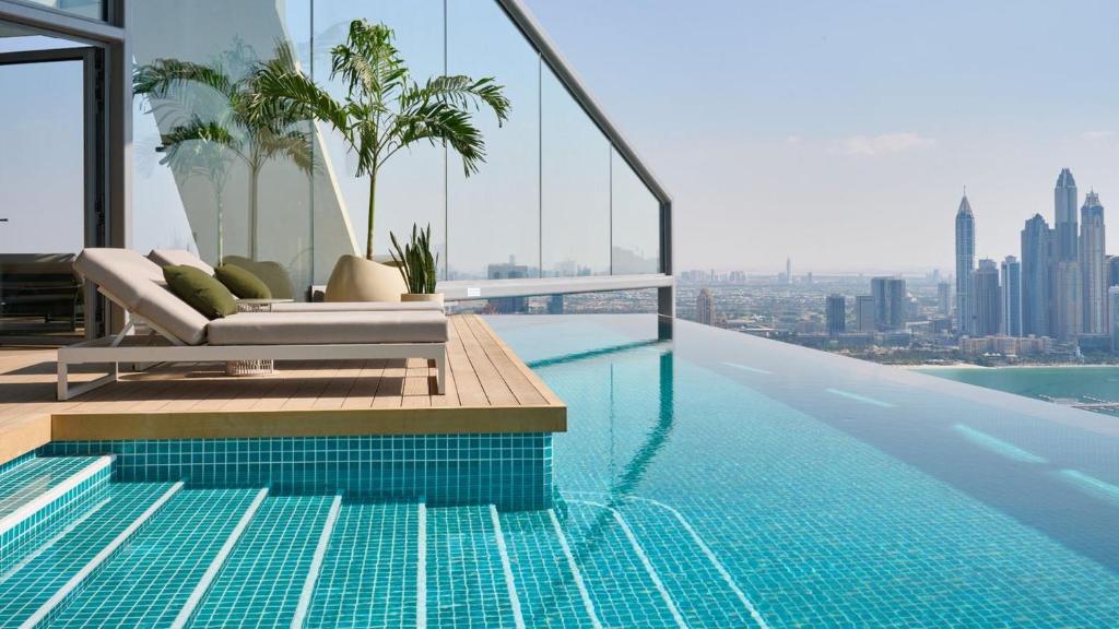 Infinity edge pool with Dubai skyline view